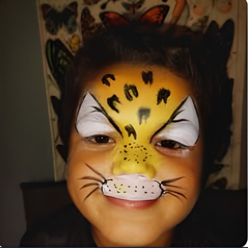 Orange and black tiger face paint design