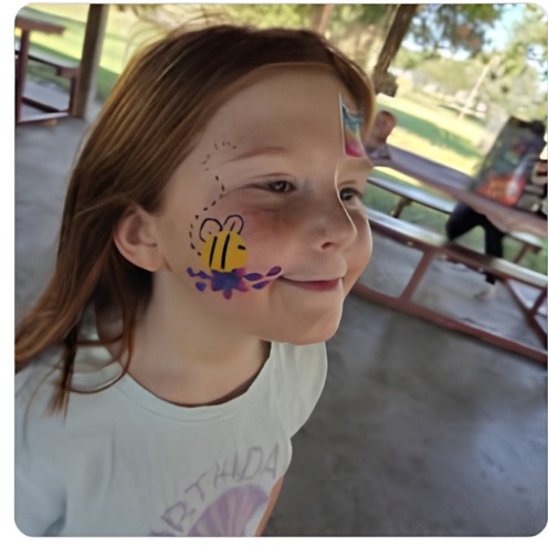 Bee and flower cheek face paint design