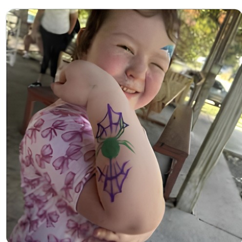Purple spider web arm design