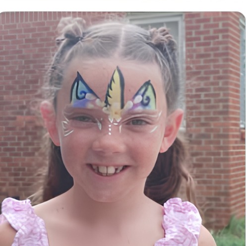 Colorful rainbow wing crown face paint design