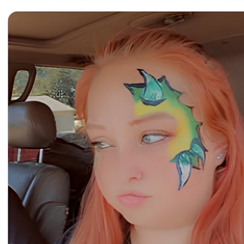 Green and blue dragon wing eye face paint design