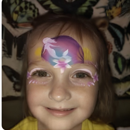 Pink and purple unicorn face paint design