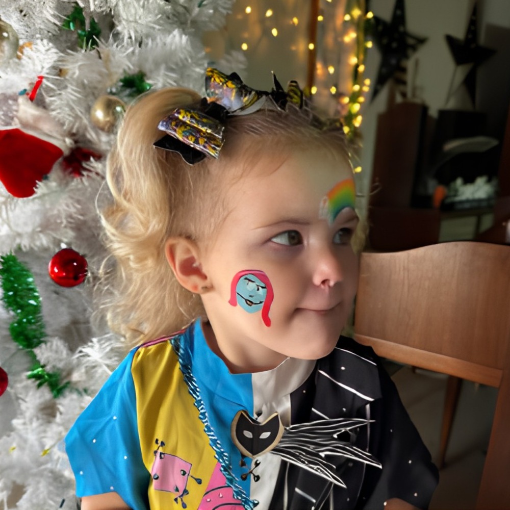 Cartoon character cheek and rainbow face paint design